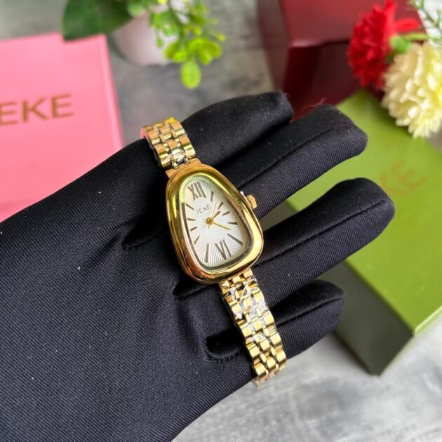 ساعة نسائية IEKE 88241 براصلي ذهبي بخلفية بيضاء