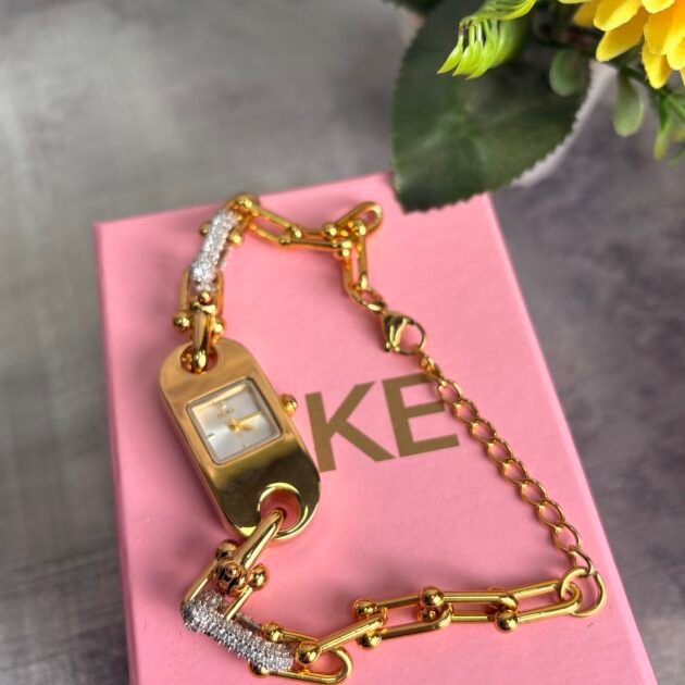 ساعة نسائية IEKE 88244 براصلي ذهبي بخلفية بيضاء