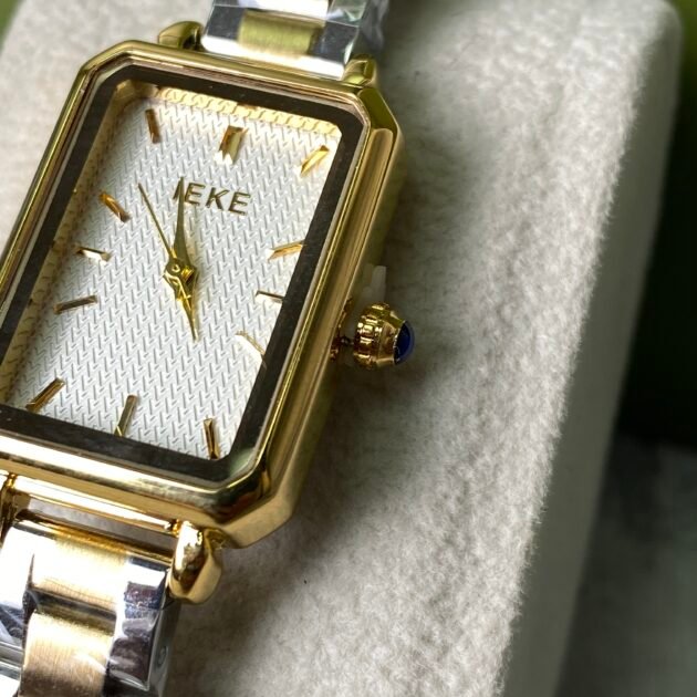 ساعة نسائية IEKE 708 براصلي ذهبي فضي بخلفية بيضاء